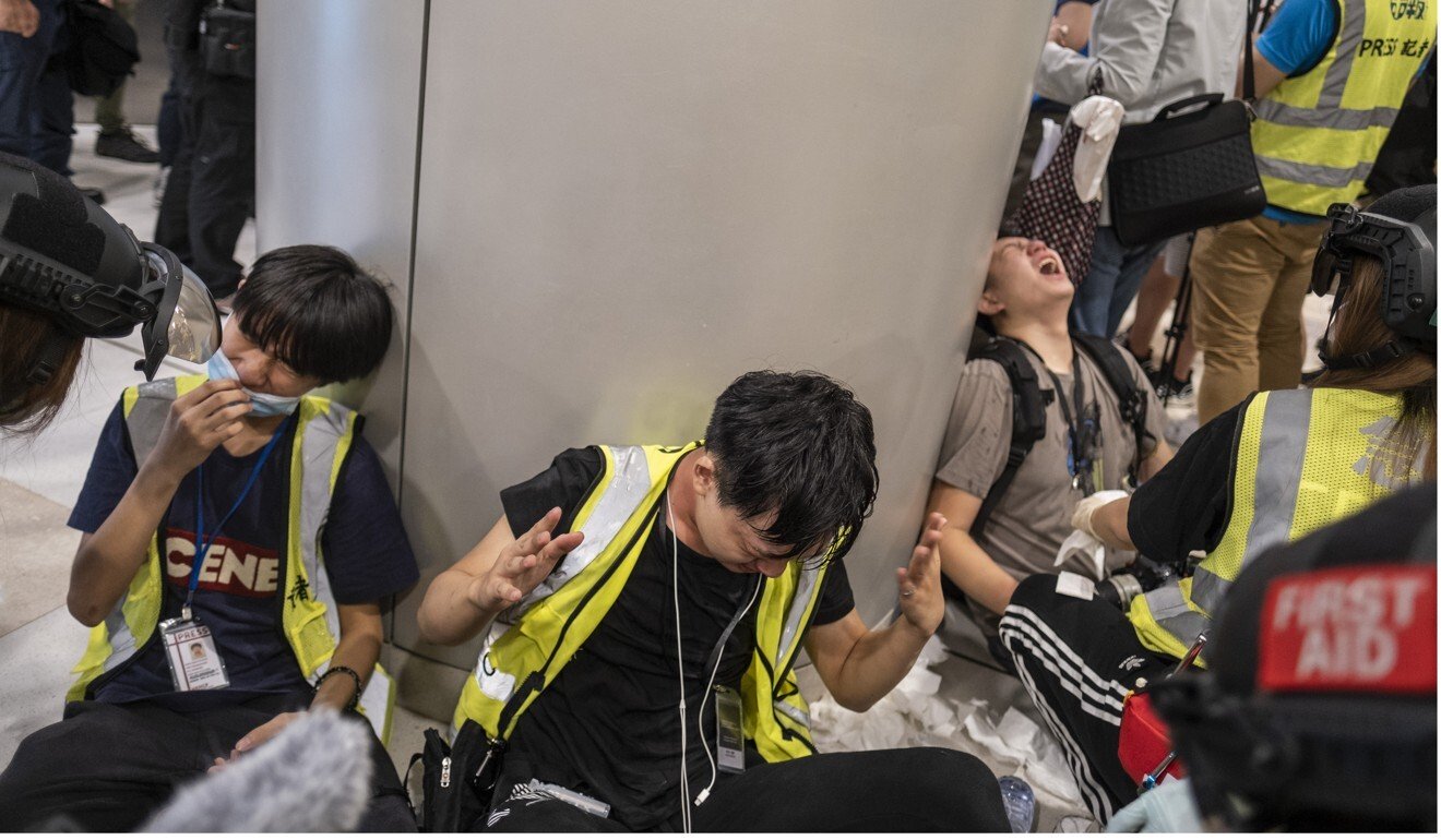 Hong Kong lunchtime protesters return after coronavirus social-distancing rules are eased but police quickly disperse group in mall with pepper spray