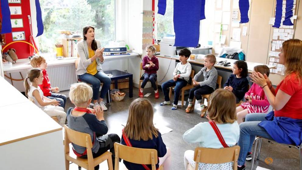 Excited children, anxious parents: Swiss students go back to school