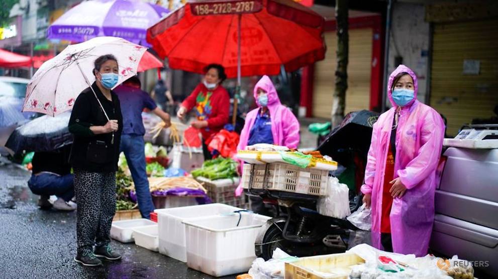 China reports 4 new COVID-19 cases; Wuhan says a third of residents tested