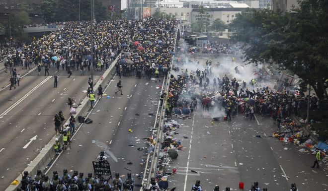 Hong Kong protests: first defendant to plead guilty to riot charge jailed for four years