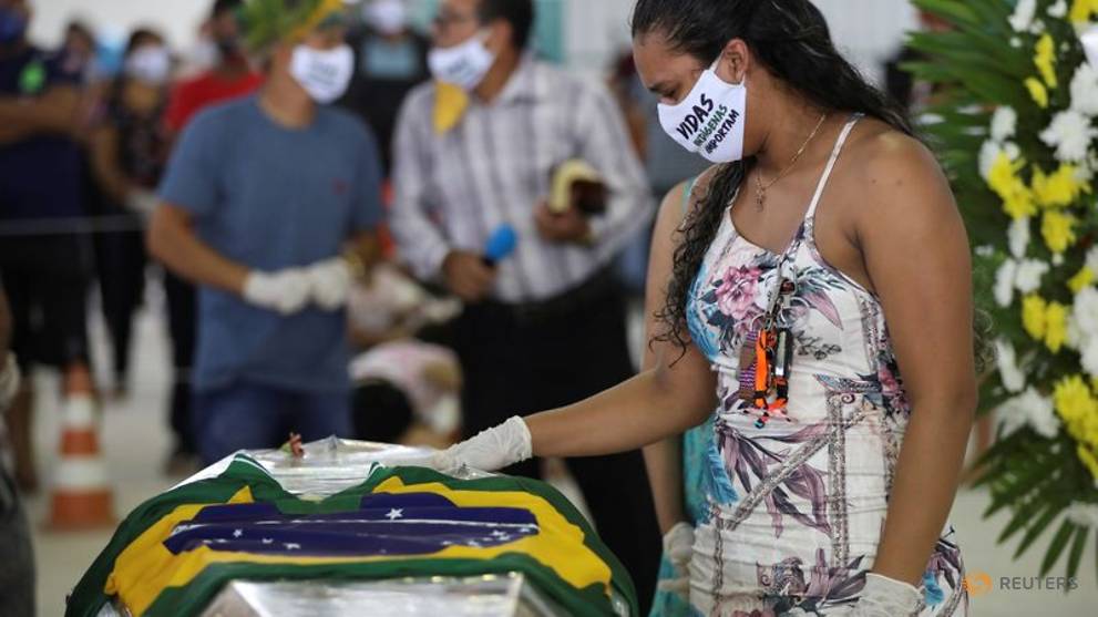 In Amazon city, indigenous chief felled by COVID-19 buried with dance and singing