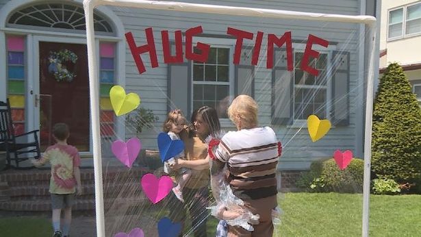 Great-grandma, 85, finally gets to embrace great-grandkids thanks to 'hug machine'