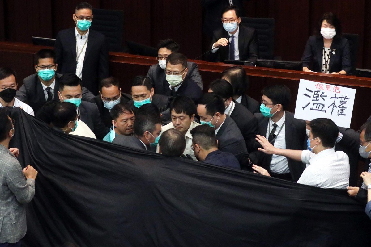 Hong Kong lawmakers thrown out of key Legislative Council meeting after clash with security guards
