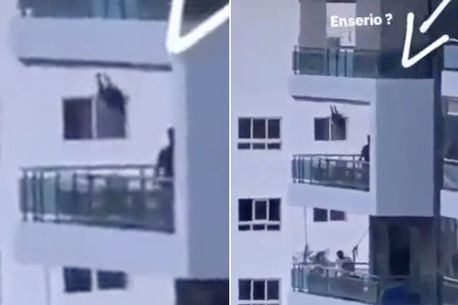 Heart-stopping moment dad spotted pushing toddler on balcony swing 80ft off ground