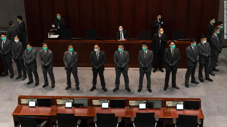 Hong Kong lawmakers scuffle as pro-Beijing politicians clear path for controversial national anthem bill