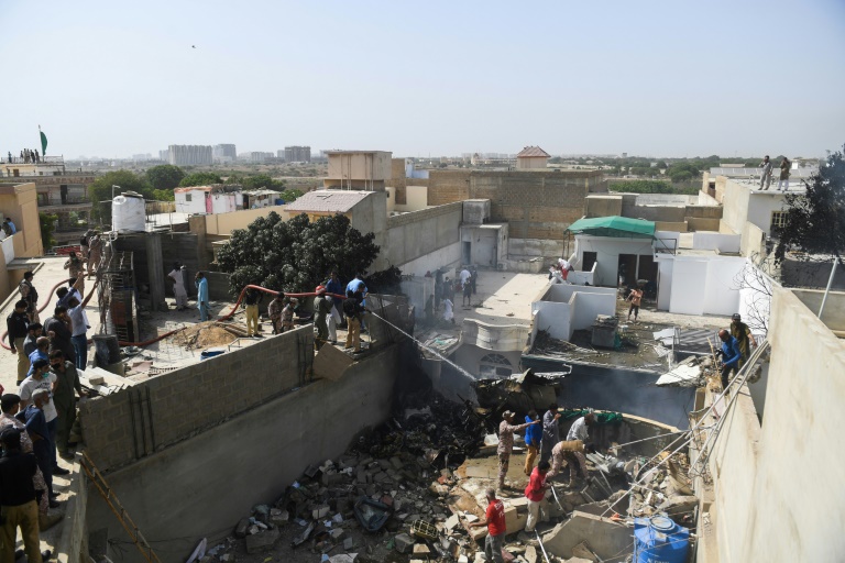 Pakistan plane with 98 aboard crashes on homes