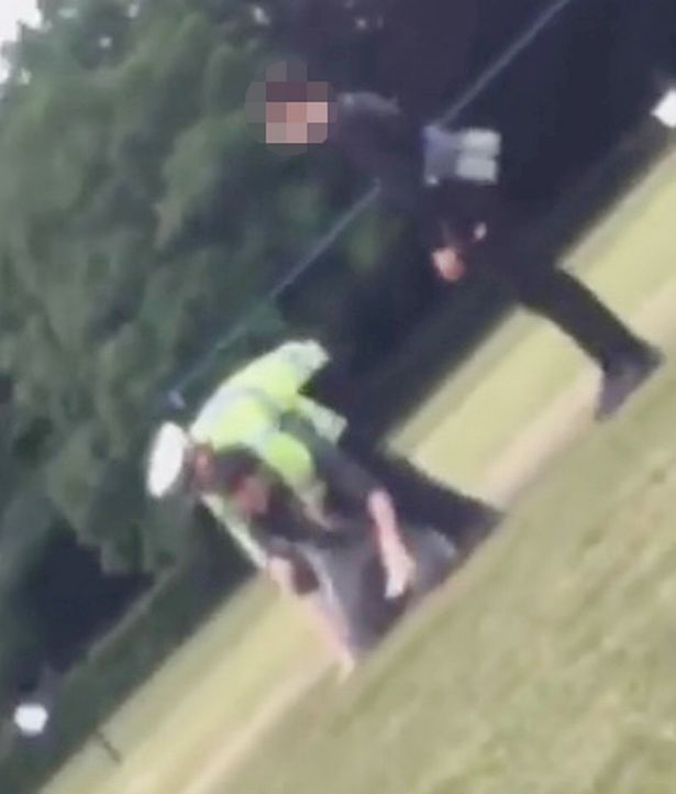 Policeman dragged along floor after he confronts gang for 'flouting lockdown'