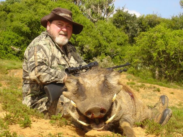 Brit who arranges safaris to slaughter young lions poses in sickening photo
