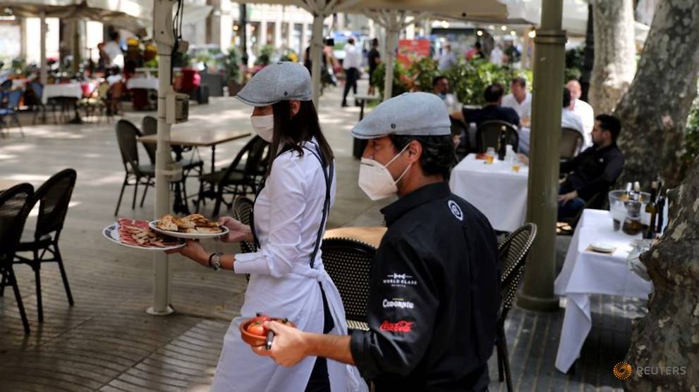 Spain revises coronavirus death toll down by nearly 2,000