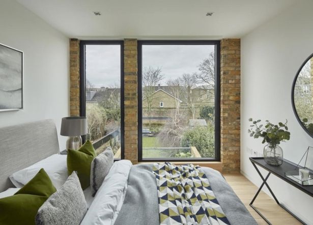 Terraced house squeezed into narrow gap looks tiny until you step through front door