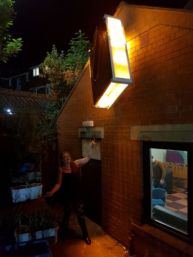 Woman in state of shock after finding bed impaled on side of house as she took bins out