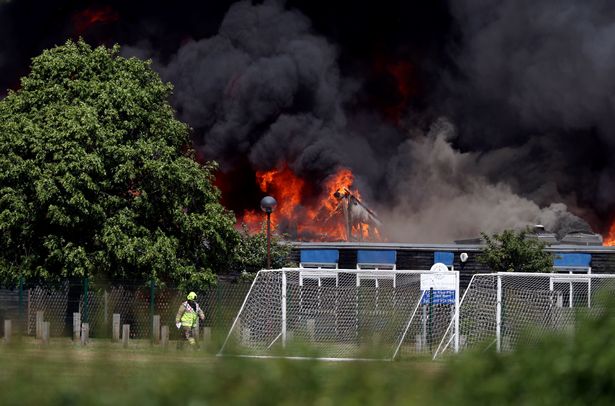 Huge fire breaks out in school building sending plumes of smoke billowing into sky