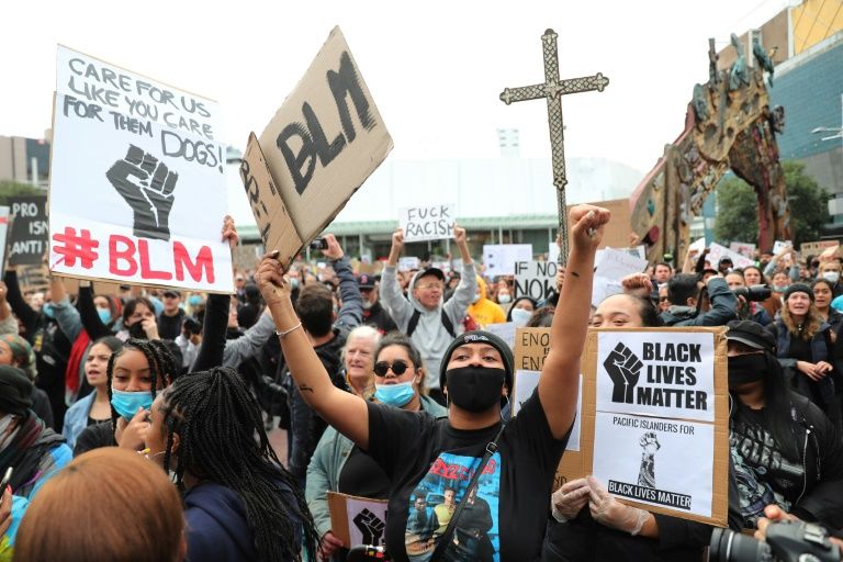 New Zealand PM chides marchers over virus rule breach