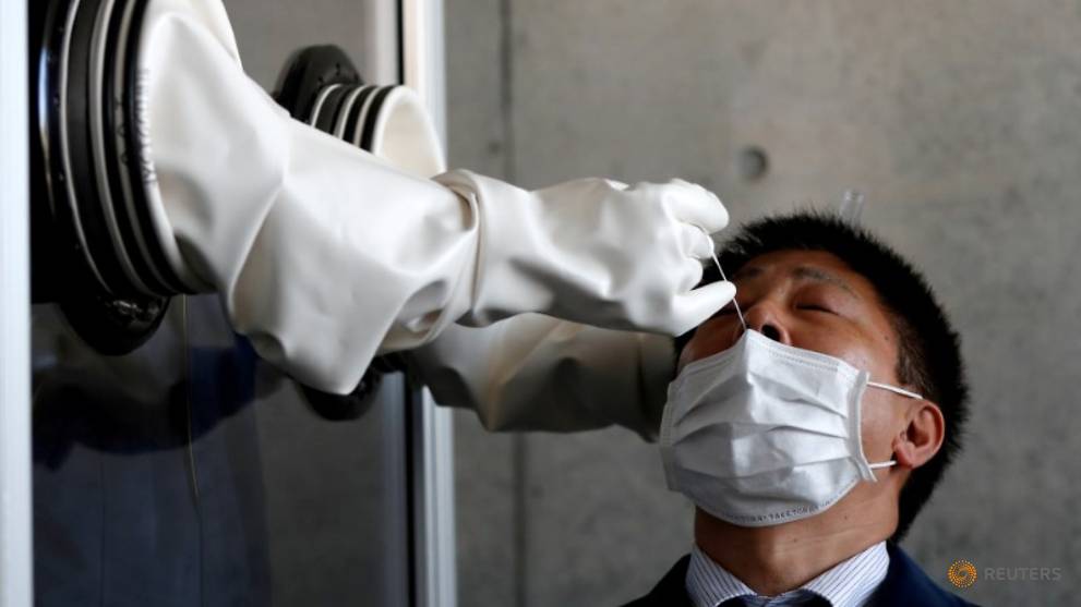 Japan allows saliva-based tests to boost COVID-19 detection