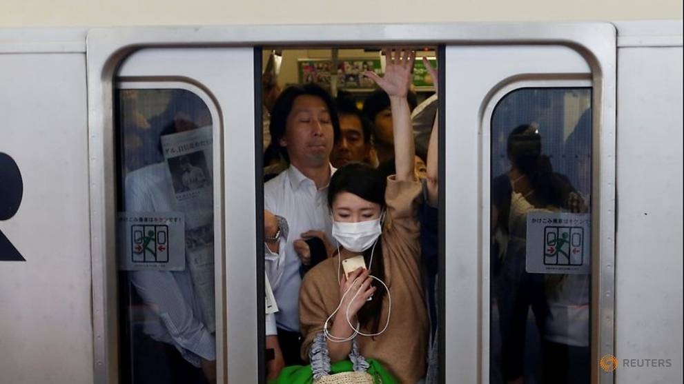 Japan's 'mosh pit' trains spark fear of new coronavirus cases