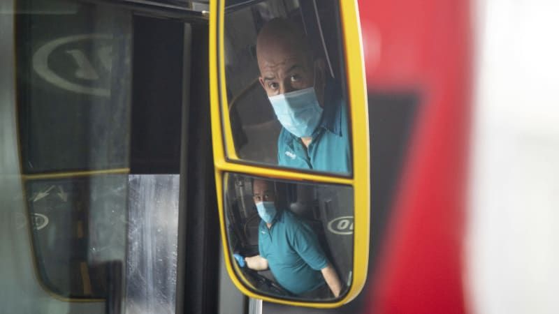 England makes face coverings mandatory on public transport