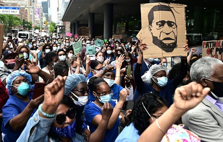 'They are the heroes now' -- virus doctors join racism protests