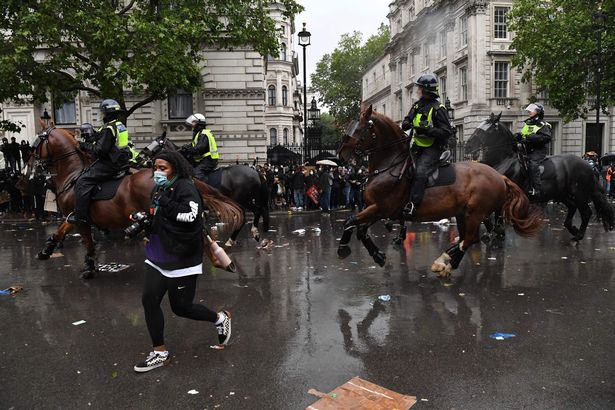 Gasps as footage shows police officer being thrown off horse after hitting traffic lights