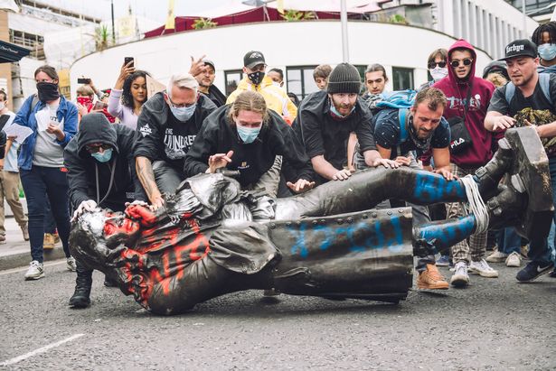 Black Lives Matter protesters say 'we're fighting two pandemics' as thousands gather