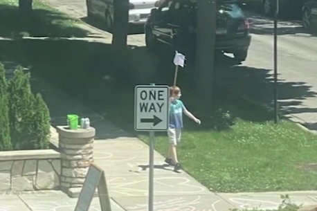 Boy, 9, stages solo Black Lives Matter march outside his home with hand-made sign
