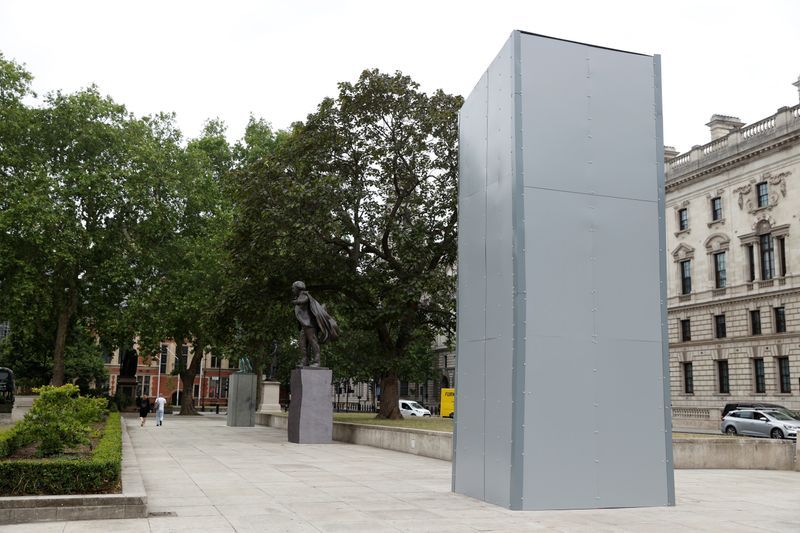 Churchill statue and war memorial boarded up before London protests
