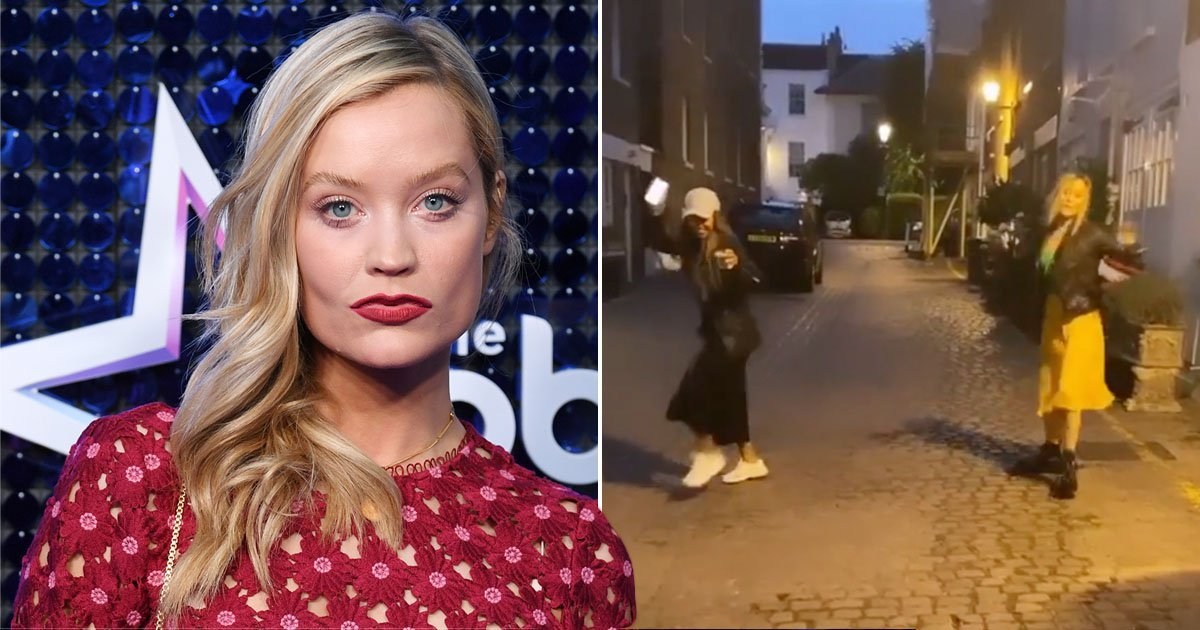 Laura Whitmore holds onto beer as she enjoys social distance dance in the streets