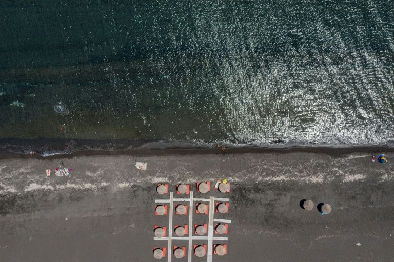 Fear and impatience as santorini awaits return of mass tourism