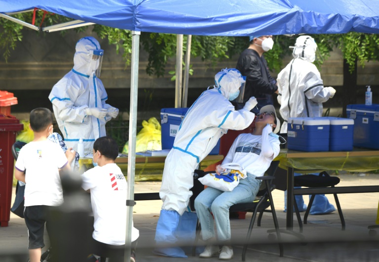 New virus cases in China, NZ sound pandemic alarm