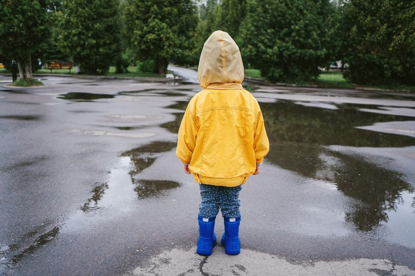 Boy, three, is found wandering the streets wearing onesie and no shoes