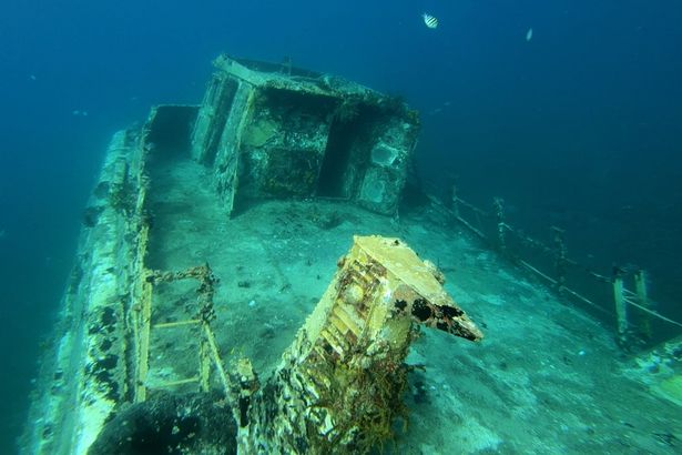 Amazing footage shot by exploring divers shows the spooky insides of sunken ship
