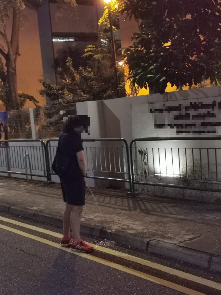 Drunk man caught urinating at the roadside