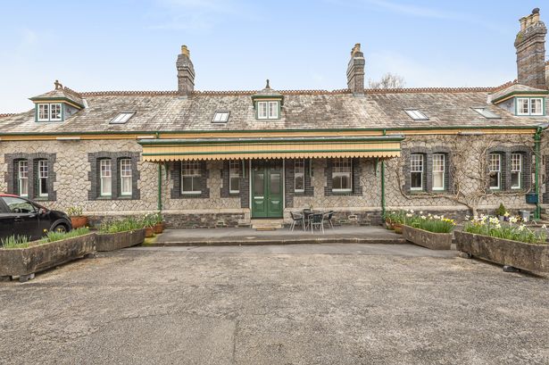Inside incredible converted railway station home on sale with courtyard on platform