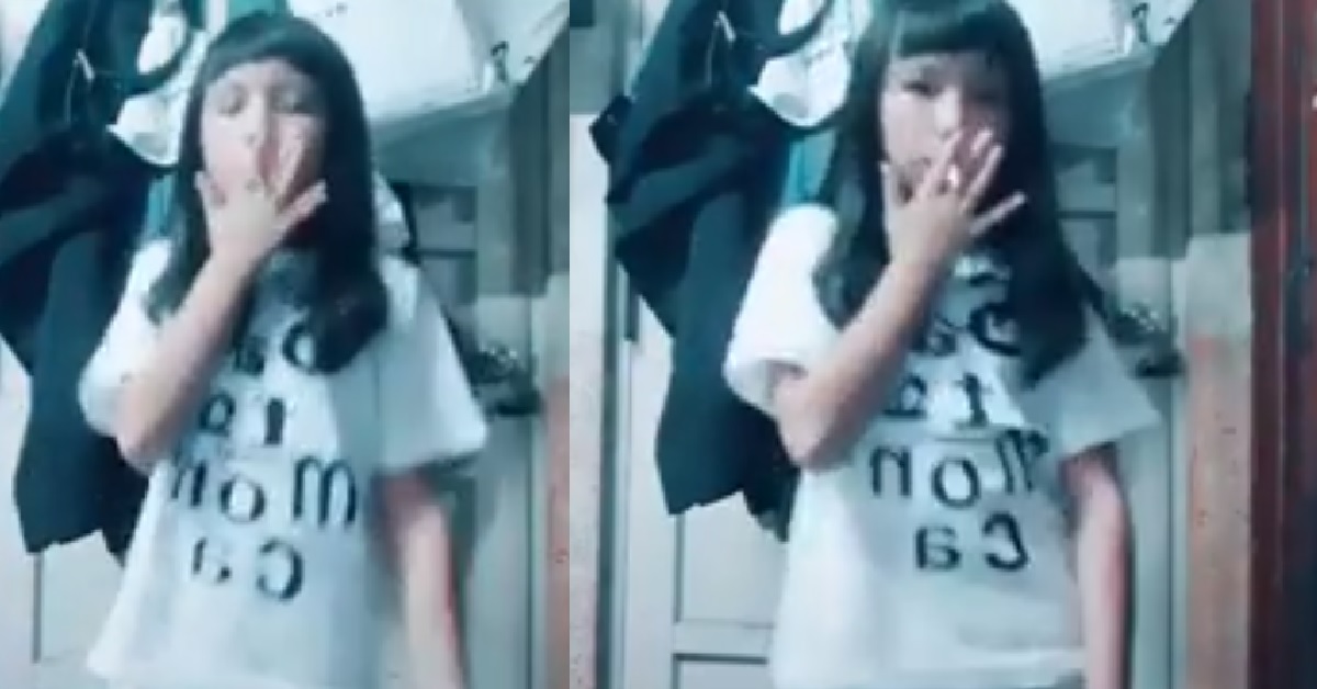 Young girl smoking while dancing for tik tok video