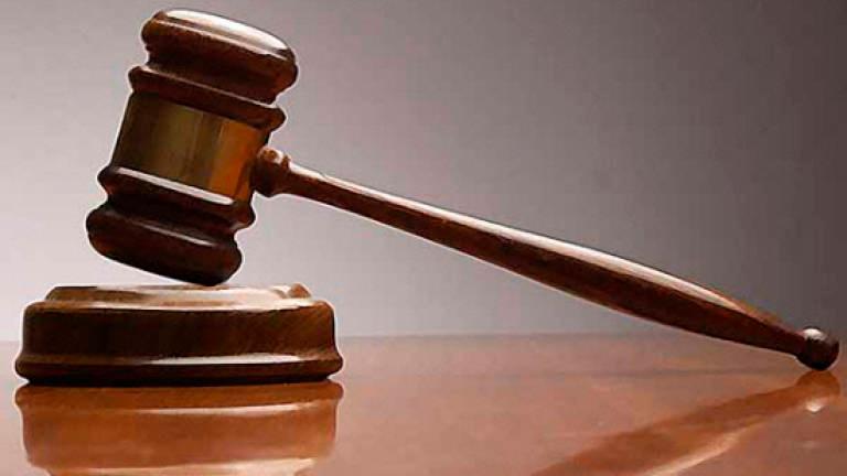PWD technician claims trial to 4 bribery charges