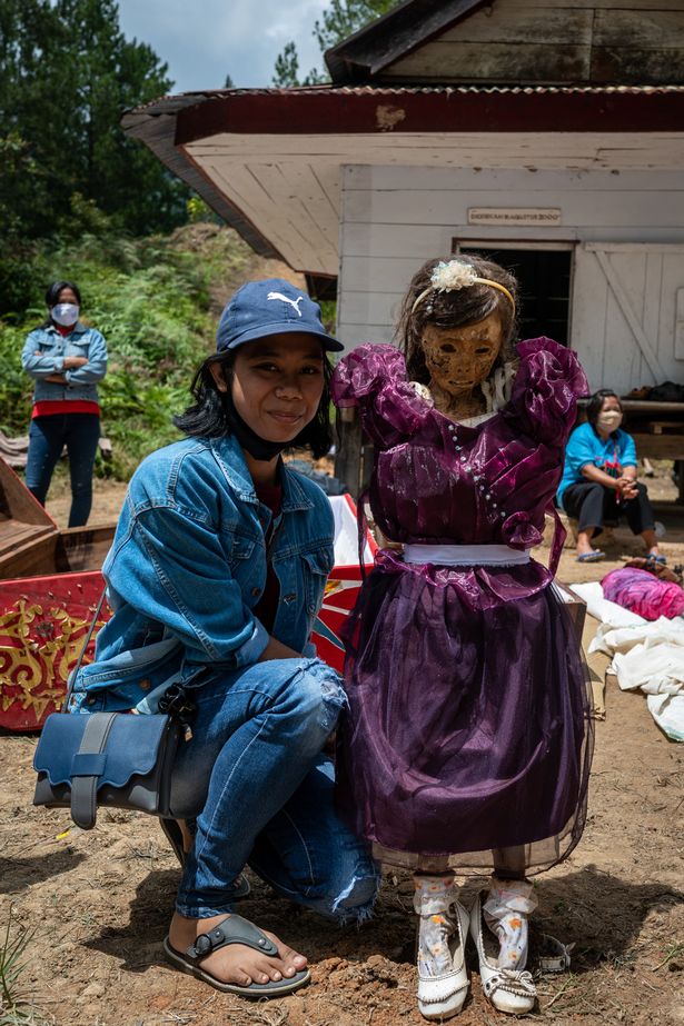 Tribe dig up loved ones’ corpses and light cigarettes for them in annual tradition