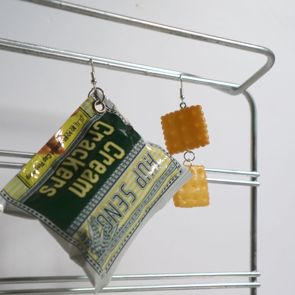 Cream cracker earrings is a throwback to school days when you dunk biscuits in milo