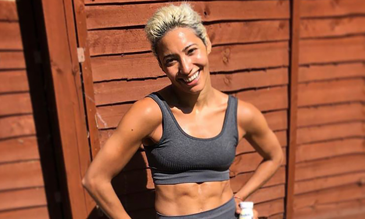 Karen Hauer shows off washboard abs as she poses in black lacy bikini