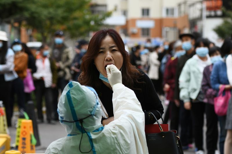 Chinese city of Qingdao punishes two officials over coronavirus cluster