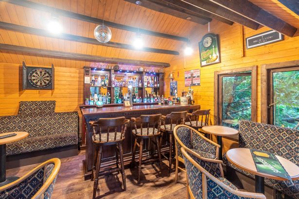 Ordinary bungalow for sale with its own secret pub to get around 10pm last orders