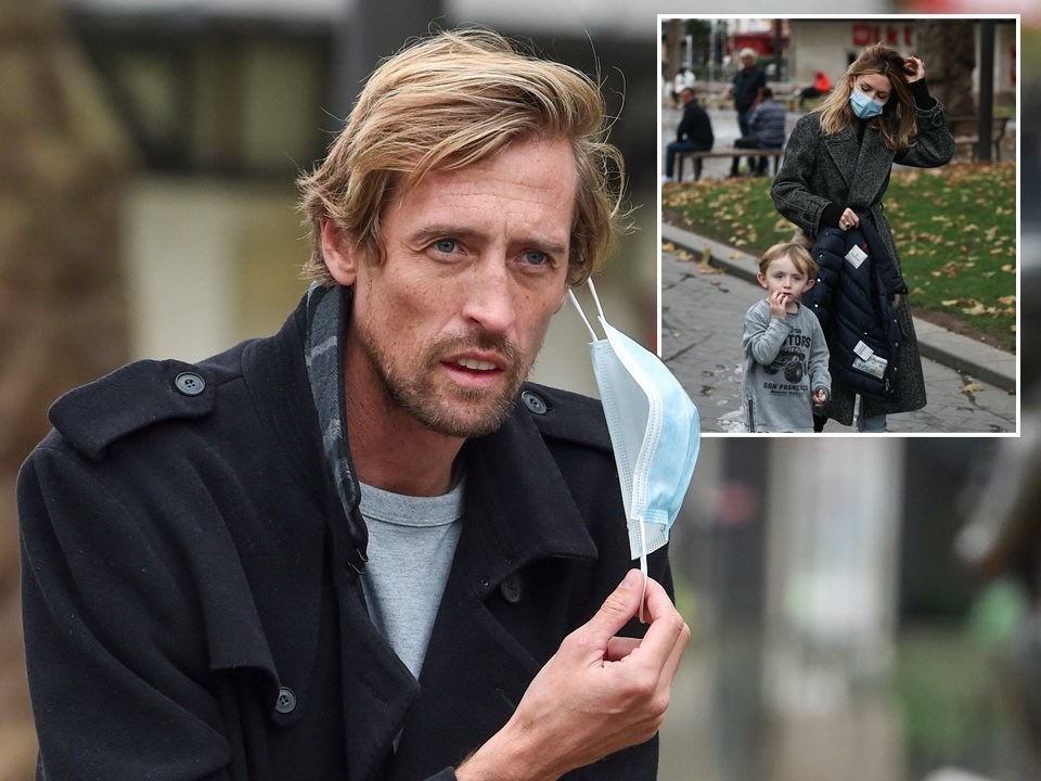 Abbey Clancy and Peter Crouch mask up for cute family stroll around fountains in Leicester Square