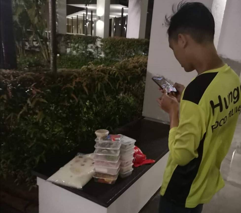 Penang woman praised for helping food delivery rider caught in the rain