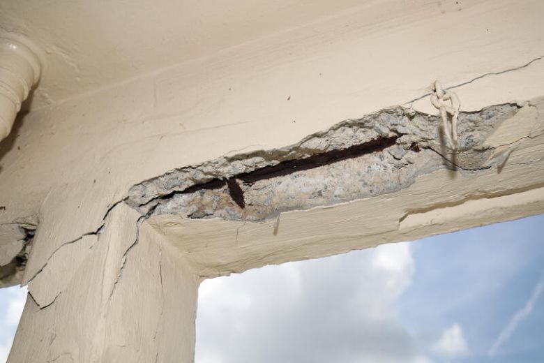 Large cracks on concrete pillars and falling limestone appear at Tampines HDB block