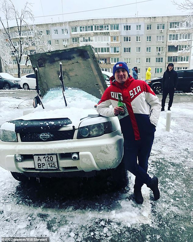 Man cheats death when 8ft concrete slab falls 100ft onto his car as he scraped ice from the windscreen in Russia