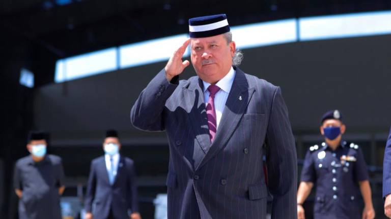 The Sultan of Johor confers DMIJ on four individuals