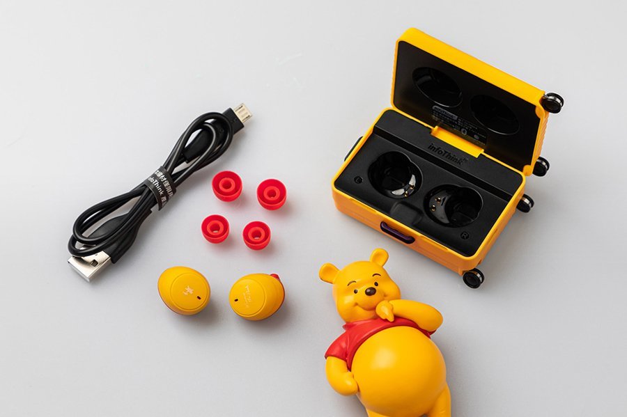 Winnie the pooh wireless earbuds in mini luggage will make the travel to work sweeter