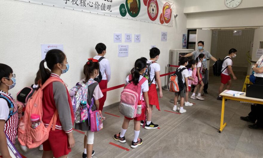 Hong Kong suspends in-person school lessons as Covid-19 cases climb