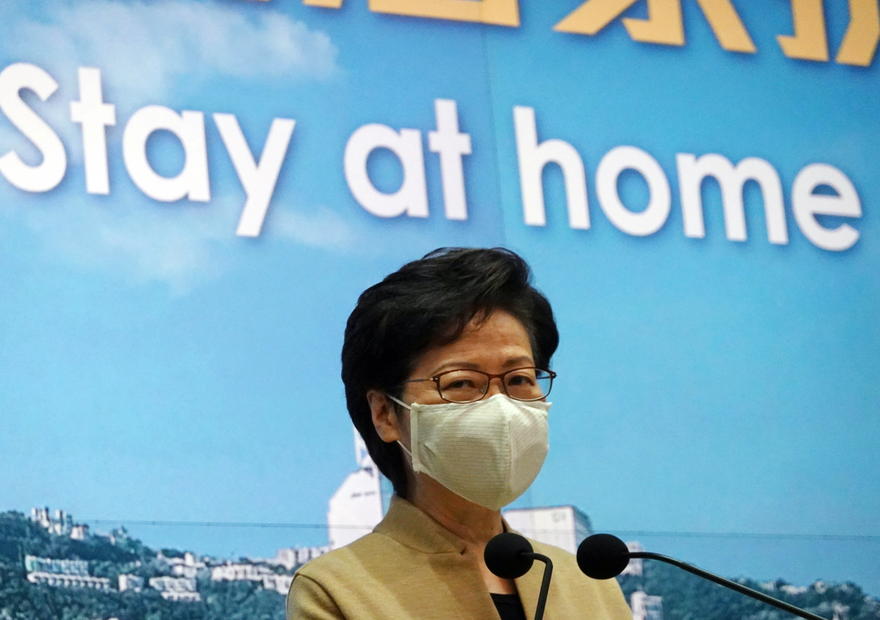 Stay at home, Hong Kong leader urges as COVID-19 surges anew