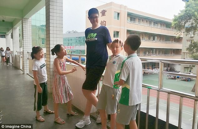 Teen in China is So Tall, He Has a Special Desk & Chair Made for Him