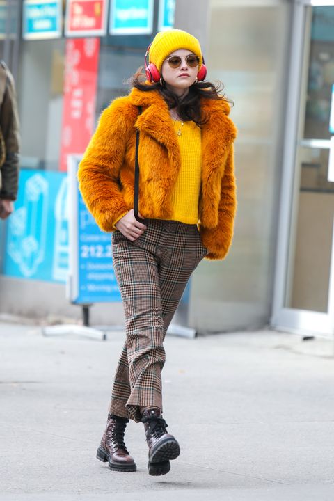 Here's Selena Gomez Looking Like a Bombshell in a Red Jumpsuit and Long Teddy Coat