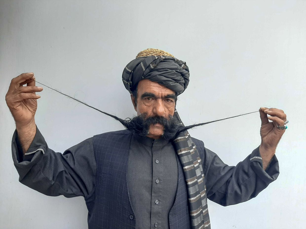 Kabul tailor’s 60cm-long moustache has made him a local celebrity in Afghanistan